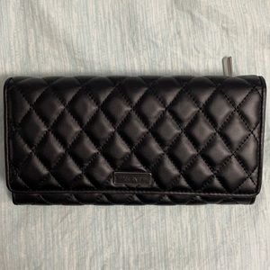 Authentic Tumi leather quilted wallet